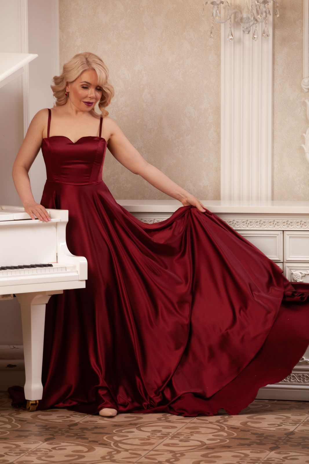 Classical concert pianist Dr. Maria Pisarenko at a white grand piano, Las Vegas
